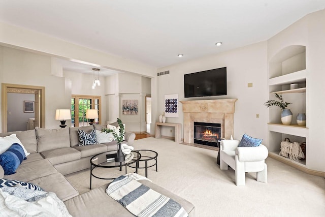 N53W16527 Whitetail Run, Menomonee Falls, WI 53051 - carpeted living area with radiator heating unit, built in shelves, and a premium fireplace