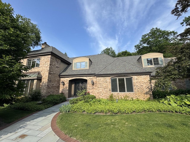 13835 Stonefield Ct, Elm Grove, WI 53122 - french country inspired facade featuring brick siding and a front yard