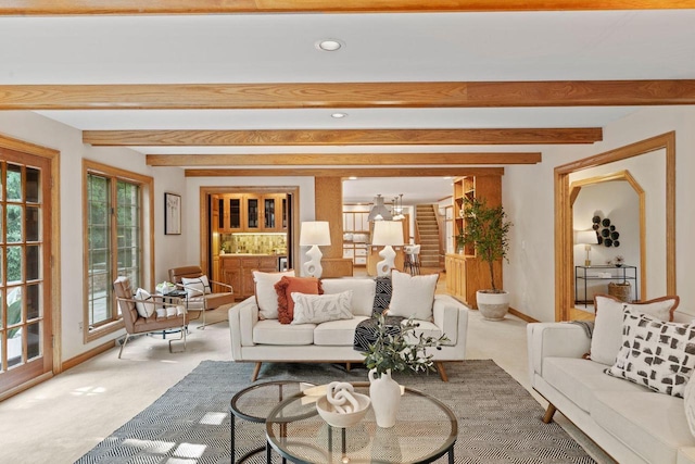 13835 Stonefield Ct, Elm Grove, WI 53122 - carpeted living area featuring healthy amount of natural light, beam ceiling, recessed lighting, and a chandelier