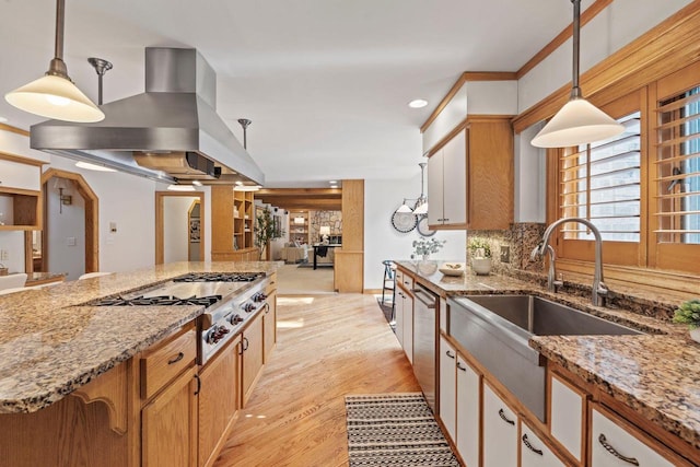 13835 Stonefield Ct, Elm Grove, WI 53122 - kitchen with appliances with stainless steel finishes, ventilation hood, light wood finished floors, light stone countertops, and decorative light fixtures