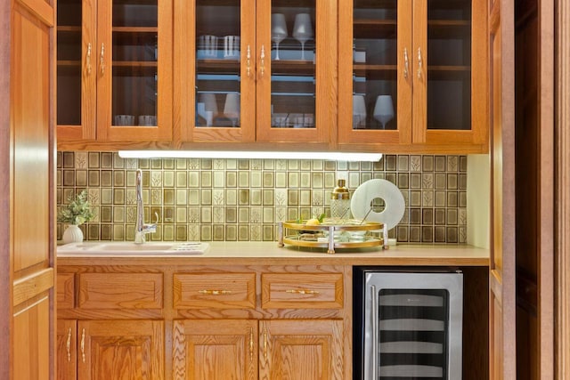 13835 Stonefield Ct, Elm Grove, WI 53122 - bar featuring beverage cooler and tasteful backsplash