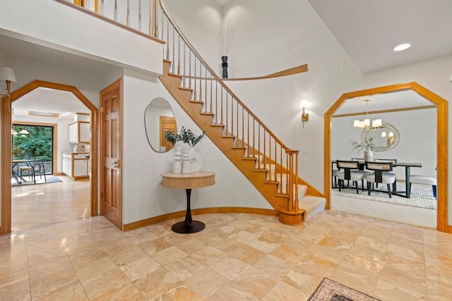 13835 Stonefield Ct, Elm Grove, WI 53122 - staircase with a chandelier, a towering ceiling, and recessed lighting