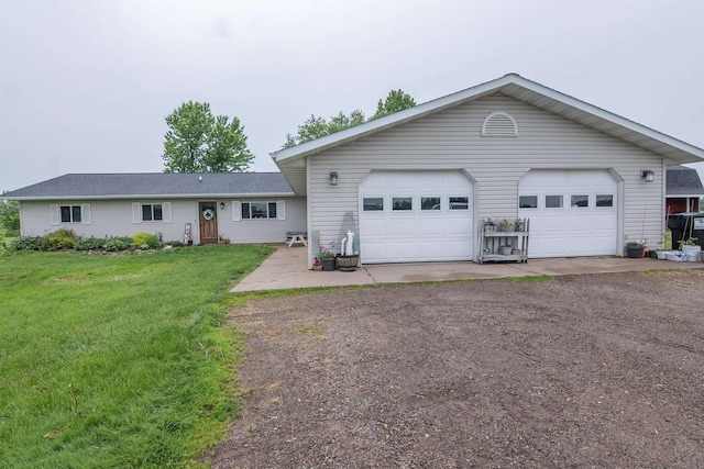 N3315 Brook Dr, Medford, WI 54451 - view of front of home with dirt driveway, a front lawn, and a garage