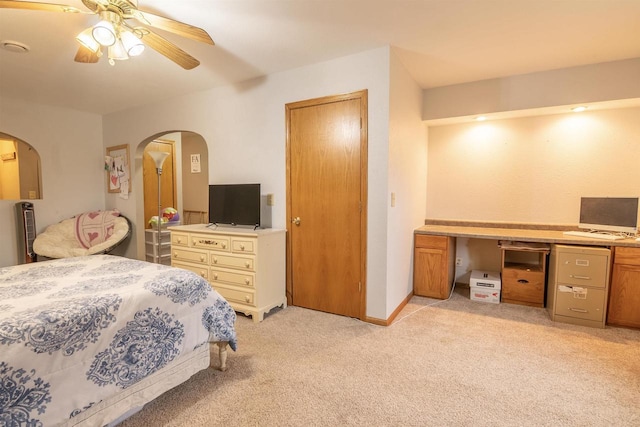 N3315 Brook Dr, Medford, WI 54451 - bedroom featuring arched walkways, light carpet, a ceiling fan, and a desk