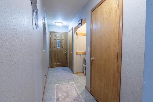 N3315 Brook Dr, Medford, WI 54451 - hallway featuring a textured wall and light tile patterned floors