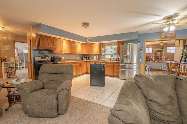 N3315 Brook Dr, Medford, WI 54451 - kitchen with appliances with stainless steel finishes, premium range hood, open floor plan, light colored carpet, and a ceiling fan