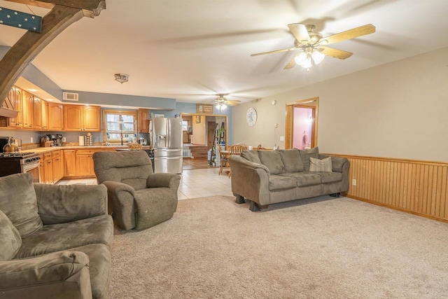 N3315 Brook Dr, Medford, WI 54451 - living room featuring a ceiling fan, wainscoting, and light carpet