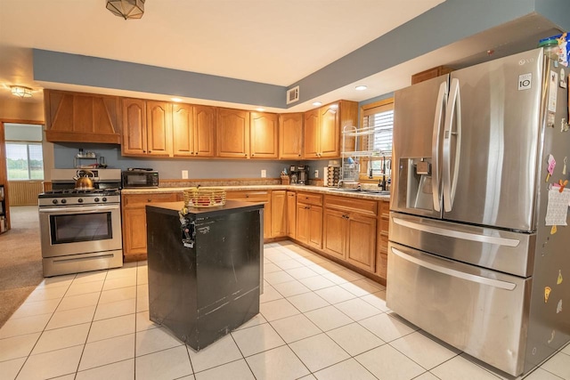 N3315 Brook Dr, Medford, WI 54451 - kitchen with stainless steel appliances, custom exhaust hood, plenty of natural light, light tile patterned floors, and recessed lighting