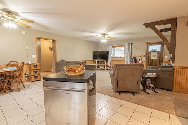 N3315 Brook Dr, Medford, WI 54451 - living area featuring ceiling fan, light colored carpet, a wainscoted wall, and light tile patterned floors