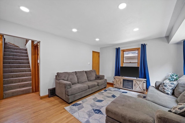 165 N 72nd St, Milwaukee, WI 53213 - living room featuring recessed lighting, light wood-style flooring, and stairway