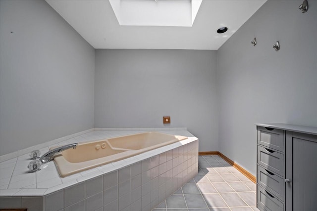 165 N 72nd St, Milwaukee, WI 53213 - bathroom featuring a skylight, a garden tub, and tile patterned flooring