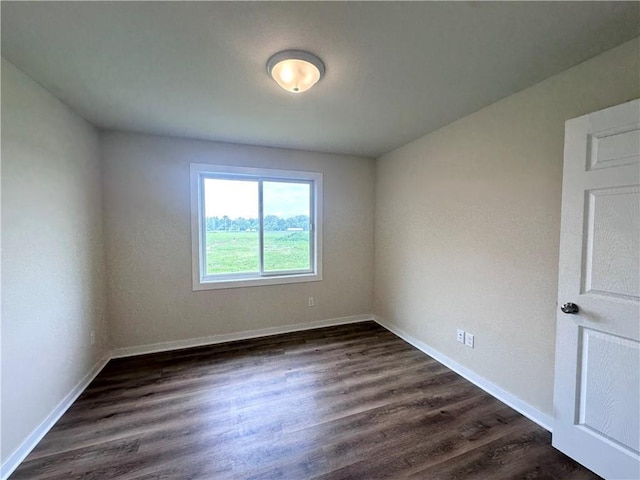 308 Dunn St, Colfax, WI 54730 - unfurnished room with dark wood-type flooring and baseboards