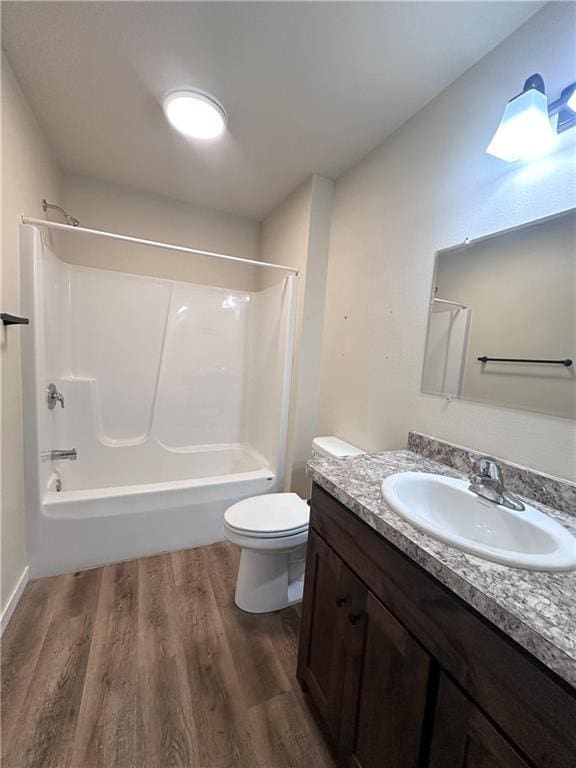 308 Dunn St, Colfax, WI 54730 - full bathroom featuring vanity, wood finished floors, and shower / tub combination