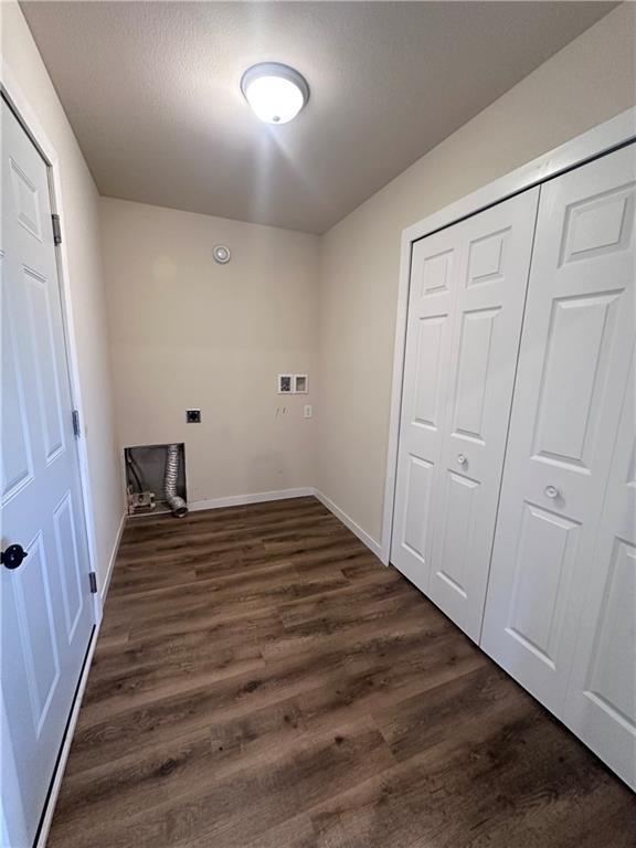 308 Dunn St, Colfax, WI 54730 - washroom featuring dark wood-style flooring and washer hookup