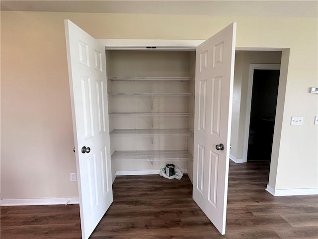 308 Dunn St, Colfax, WI 54730 - laundry room featuring wood finished floors and baseboards