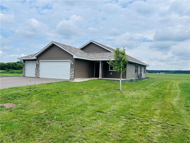308 Dunn St, Colfax, WI 54730 - ranch-style house with an attached garage, asphalt driveway, a front yard, and roof with shingles