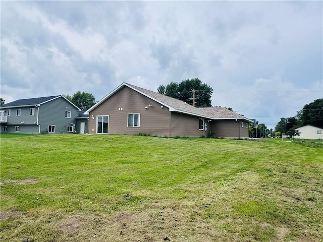 308 Dunn St, Colfax, WI 54730 - rear view of house with a lawn