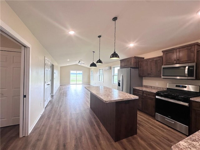 308 Dunn St, Colfax, WI 54730 - kitchen with stainless steel appliances, lofted ceiling, dark brown cabinets, open floor plan, and dark wood-style floors