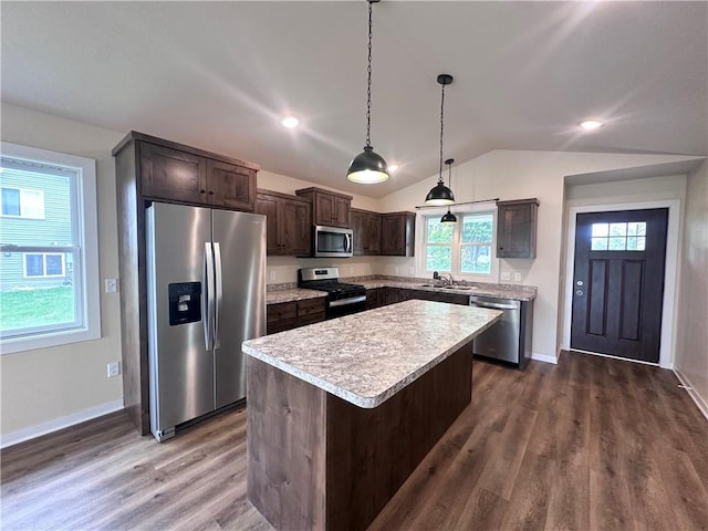 308 Dunn St, Colfax, WI 54730 - kitchen with appliances with stainless steel finishes, dark brown cabinetry, dark wood-type flooring, vaulted ceiling, and light countertops