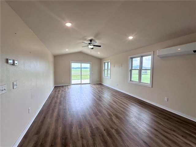 308 Dunn St, Colfax, WI 54730 - spare room with a wall unit AC, ceiling fan, dark wood finished floors, vaulted ceiling, and recessed lighting