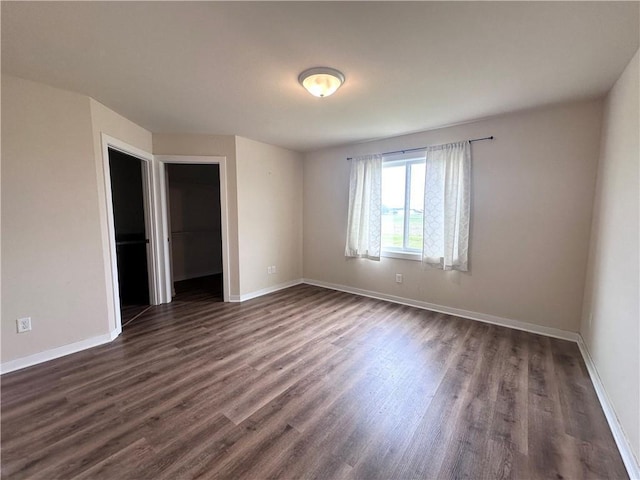 308 Dunn St, Colfax, WI 54730 - unfurnished room with dark wood-style floors and baseboards