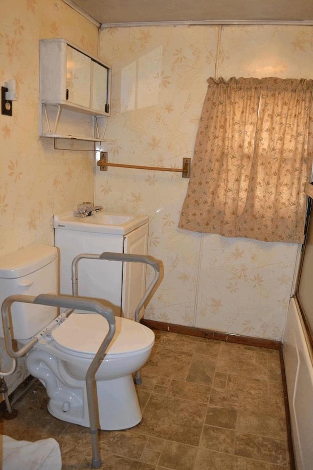 653 Grant St, Wonewoc, WI 53968 - full bath with wallpapered walls, vanity, and a bath