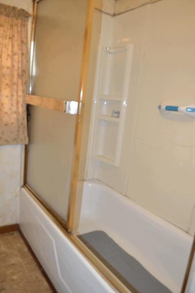 653 Grant St, Wonewoc, WI 53968 - full bath with enclosed tub / shower combo and baseboards