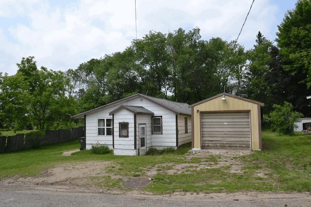 653 Grant St, Wonewoc, WI 53968 - view of front of home featuring an outdoor structure and driveway