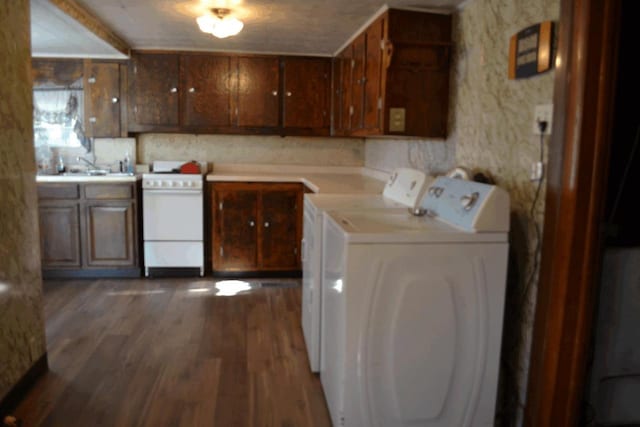 653 Grant St, Wonewoc, WI 53968 - laundry area featuring washing machine and clothes dryer and dark wood-style floors