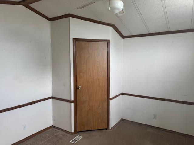 W211N11783 Hilltop Cir, Germantown, WI 53022 - empty room featuring vaulted ceiling
