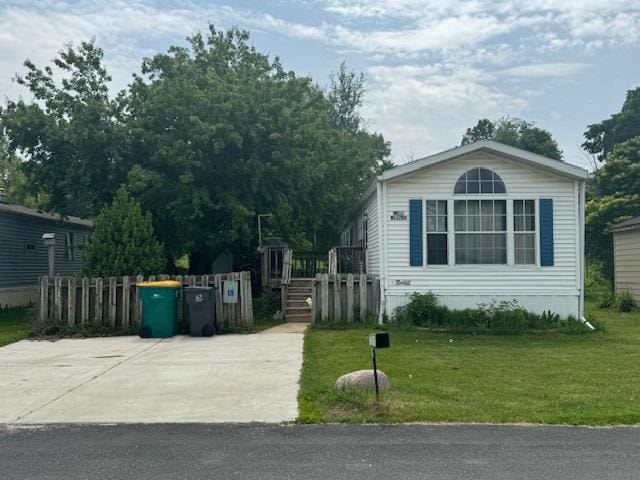 W211N11783 Hilltop Cir, Germantown, WI 53022 - manufactured / mobile home with a wooden deck