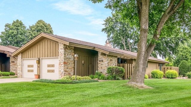 514 Fairfield Ct, Chippewa Falls, WI 54729 - mid-century home featuring stone siding, board and batten siding, concrete driveway, an attached garage, and a chimney