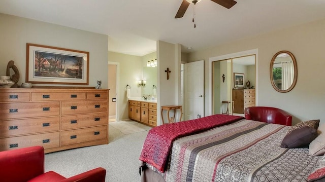 514 Fairfield Ct, Chippewa Falls, WI 54729 - bedroom with light colored carpet, ensuite bathroom, a closet, and ceiling fan