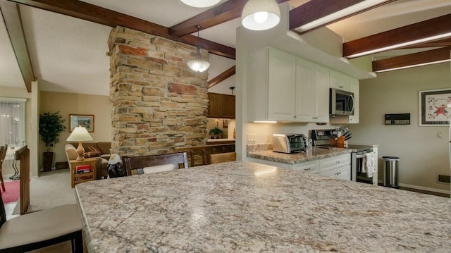 514 Fairfield Ct, Chippewa Falls, WI 54729 - kitchen with appliances with stainless steel finishes, white cabinetry, light stone countertops, and carpet floors