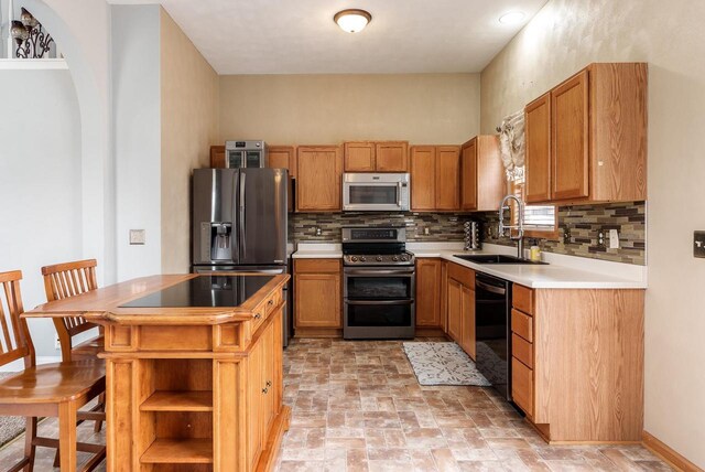 850 E Mckearn Ln, Beloit, WI 53511 - kitchen with stainless steel appliances, backsplash, open shelves, and light countertops