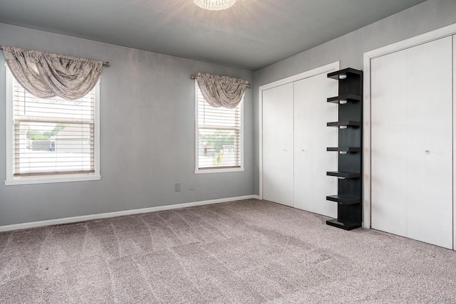 850 E Mckearn Ln, Beloit, WI 53511 - unfurnished bedroom with carpet flooring and multiple closets
