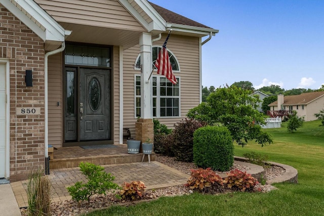 850 E Mckearn Ln, Beloit, WI 53511 - property entrance with a lawn and brick siding