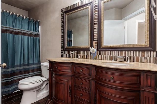 850 E Mckearn Ln, Beloit, WI 53511 - bathroom featuring double vanity, wood finished floors, tasteful backsplash, and curtained shower