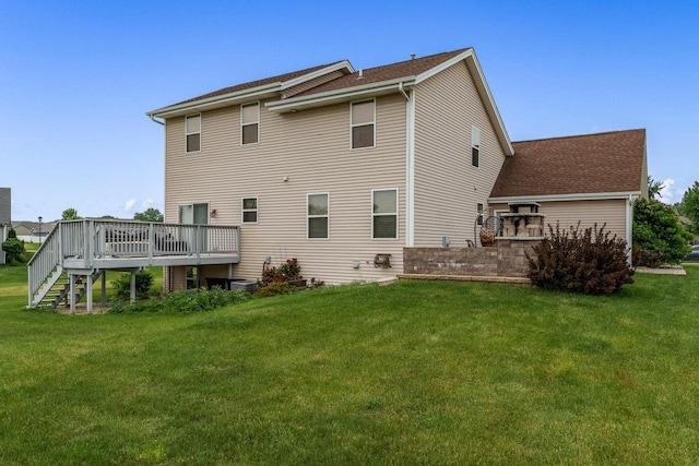 850 E Mckearn Ln, Beloit, WI 53511 - rear view of property featuring a deck, a yard, stairs, and a shingled roof