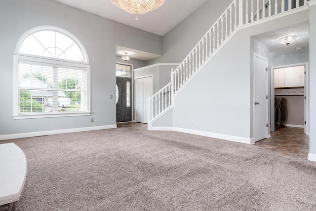 850 E Mckearn Ln, Beloit, WI 53511 - entryway featuring carpet floors, healthy amount of natural light, stairway, and a chandelier