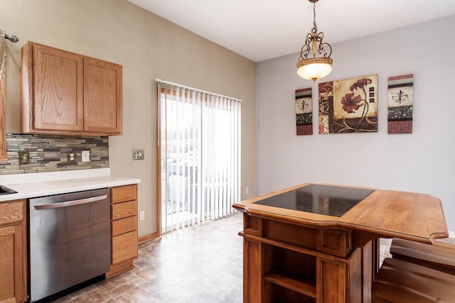 850 E Mckearn Ln, Beloit, WI 53511 - kitchen featuring stainless steel dishwasher, light countertops, pendant lighting, and tasteful backsplash