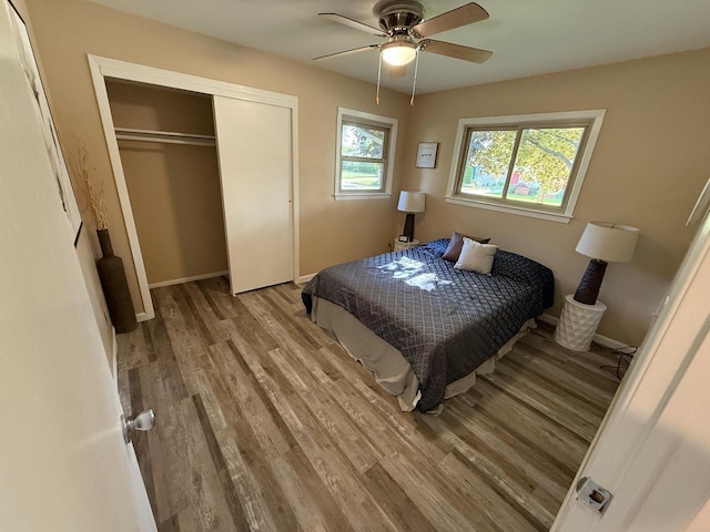 7140 N 48th St, Milwaukee, WI 53223 - bedroom with wood finished floors, a closet, and a ceiling fan
