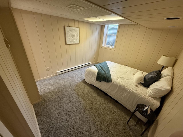7140 N 48th St, Milwaukee, WI 53223 - carpeted bedroom featuring a baseboard radiator and wooden walls