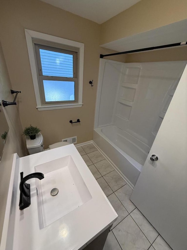 7140 N 48th St, Milwaukee, WI 53223 - bathroom with vanity, shower / tub combination, and tile patterned floors