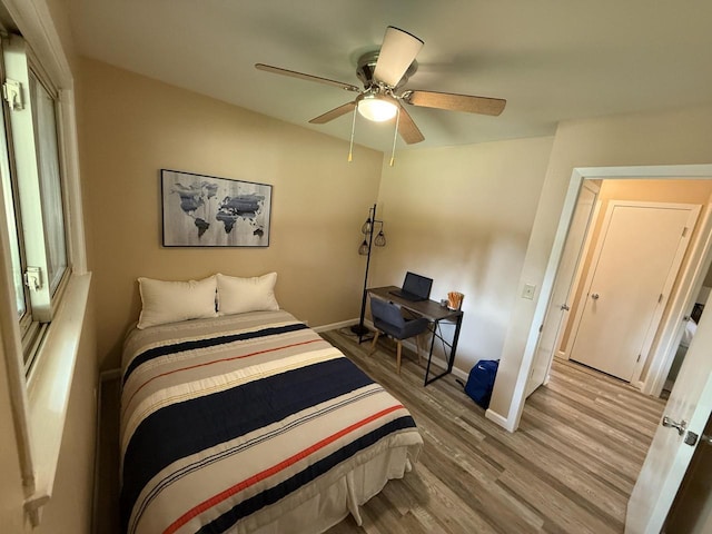 7140 N 48th St, Milwaukee, WI 53223 - bedroom with wood finished floors and a ceiling fan
