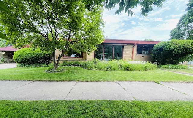 5110 W Cleveland Ave, Milwaukee, WI 53219 - single story home featuring brick siding and a front lawn