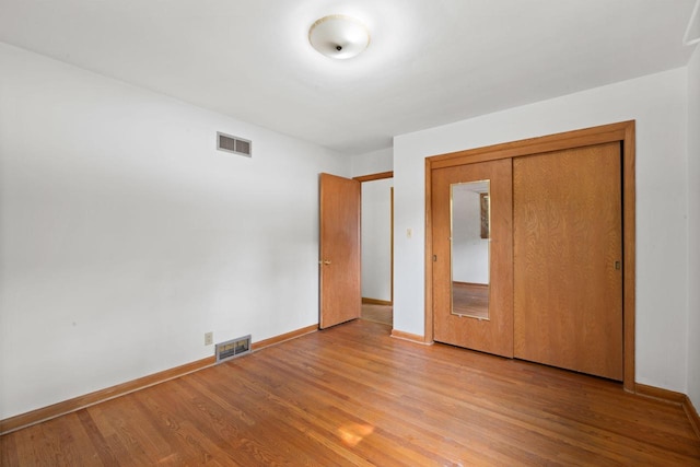 5110 W Cleveland Ave, Milwaukee, WI 53219 - unfurnished bedroom featuring light wood finished floors and a closet
