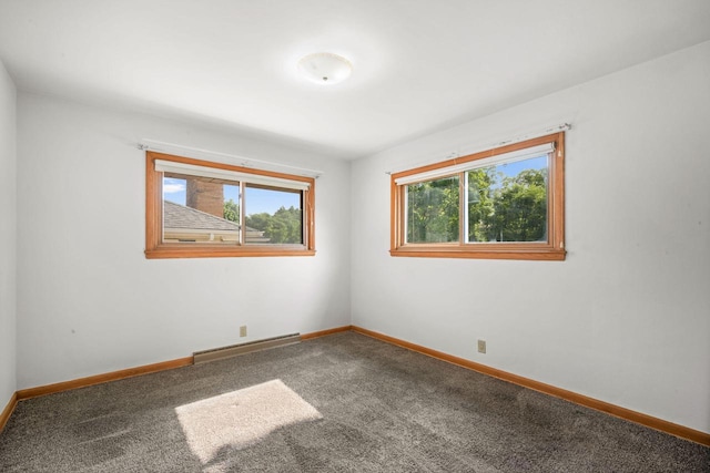 5110 W Cleveland Ave, Milwaukee, WI 53219 - spare room featuring a baseboard heating unit and carpet