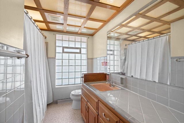 5110 W Cleveland Ave, Milwaukee, WI 53219 - bathroom with coffered ceiling, tile walls, a wainscoted wall, vanity, and baseboard heating