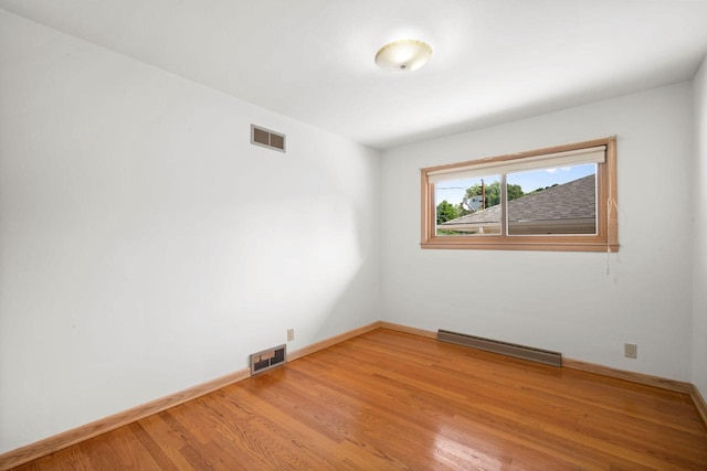5110 W Cleveland Ave, Milwaukee, WI 53219 - empty room featuring light wood finished floors and baseboard heating
